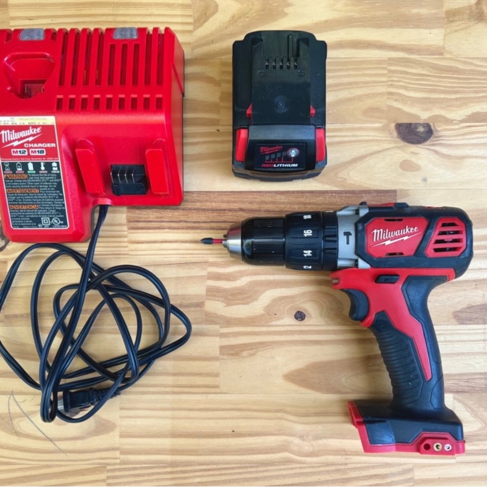 Milwaukee Red/Black Cordless Drill with Charger and Battery